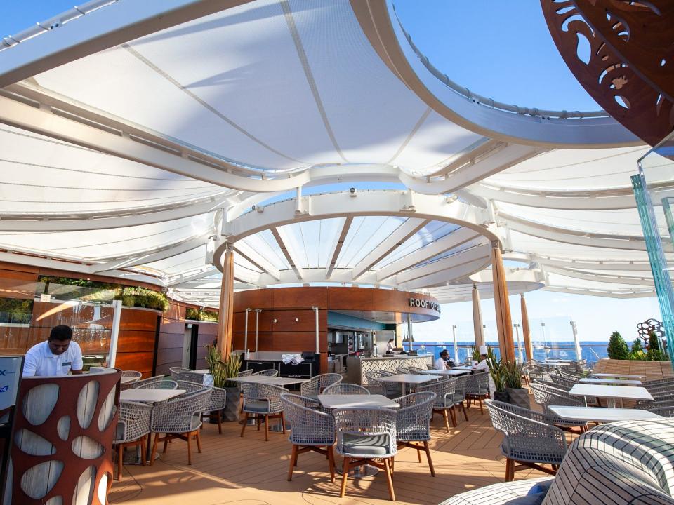 Rooftop Garden Grill under a white awning