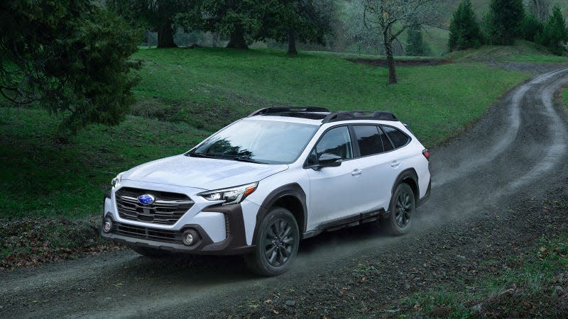 A photo of a white 2023 Subaru Outback SUV. 