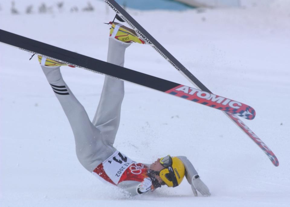 Matti Hautamaeki, of Finland, falls after landing at the 120k jump at the Utah Olympic Park during the team 120k competition February 18, 2002. | Ravell Call, Deseret News