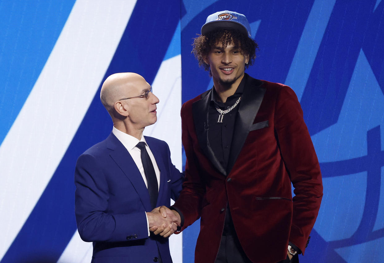 NEW YORK, NEW YORK - JUNE 22: Dereck Lively II (R) poses with NBA commissioner Adam Silver (L) after being drafted 12th overall pick by the Oklahoma City Thunder during the first round of the 2023 NBA Draft at Barclays Center on June 22, 2023 in the Brooklyn borough of New York City. NOTE TO USER: User expressly acknowledges and agrees that, by downloading and or using this photograph, User is consenting to the terms and conditions of the Getty Images License Agreement. (Photo by Sarah Stier/Getty Images)