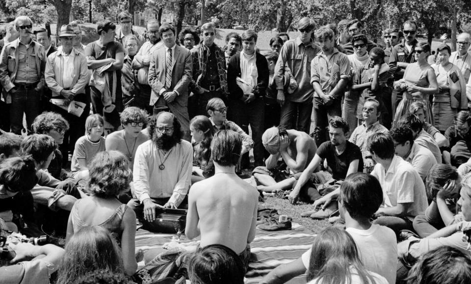 Poet Allen Ginsberg, center, sings "Om" during the Democratic convention in Chicago in August 1968.