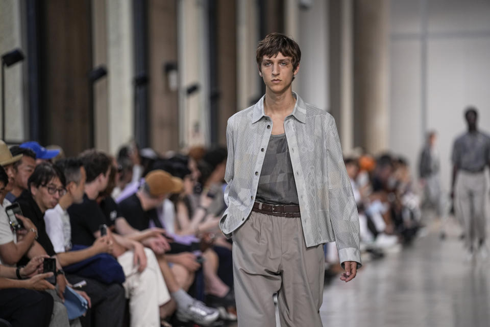 A model wears a creation for the Hermes Menswear Spring/Summer 2024 fashion collection presented in Paris, Saturday, June 24, 2023. (AP Photo/Michel Euler)