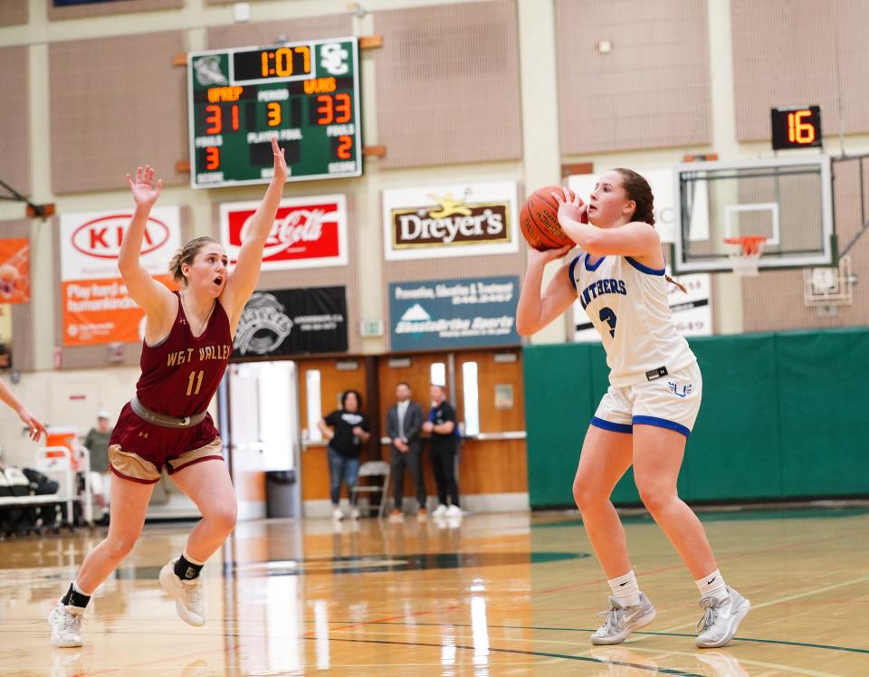 U-Prep’s Aubrey Caudell (3) looks to execute a 3-point shot against West Valley’s Kayla Wiley (11) in the third quarter of the Championship game on Saturday at Shasta College.