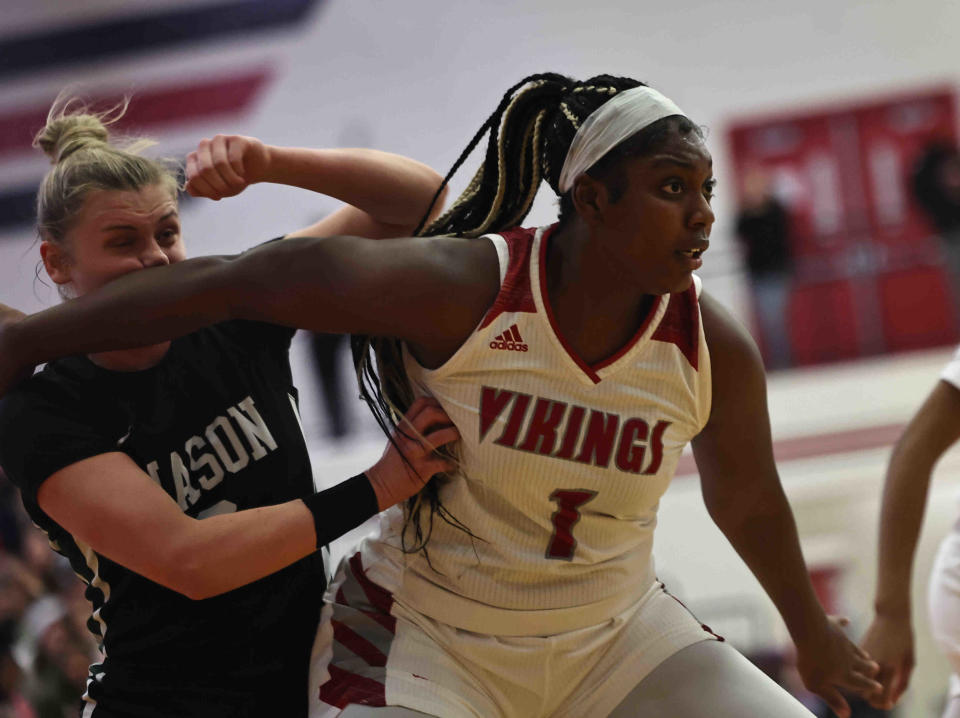 Princeton's Dede Carter-Hartley (1) battles Mason's Carly Prows (2) for rebound position during the OHSAA Division I regional tournament game Tuesday, Feb. 28, 2023.