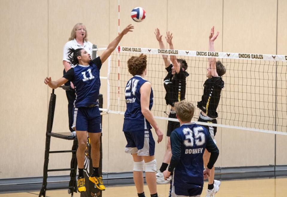 Downey’s Lloyd French (11) floats the ball into the Enochs defense during the Central California Athletic League match at Enochs High School in Modesto, Calif., Tuesday, April 4, 2023.