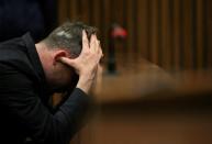 FILE PHOTO Paralympic gold medalist Oscar Pistorius reacts during the third day of the re-sentencing hearing for the 2013 murder of his girlfriend Reeva Steenkamp, at Pretoria High Court, South Africa June 15, 2016. REUTERS/Siphiwe Sibeko/File Photo