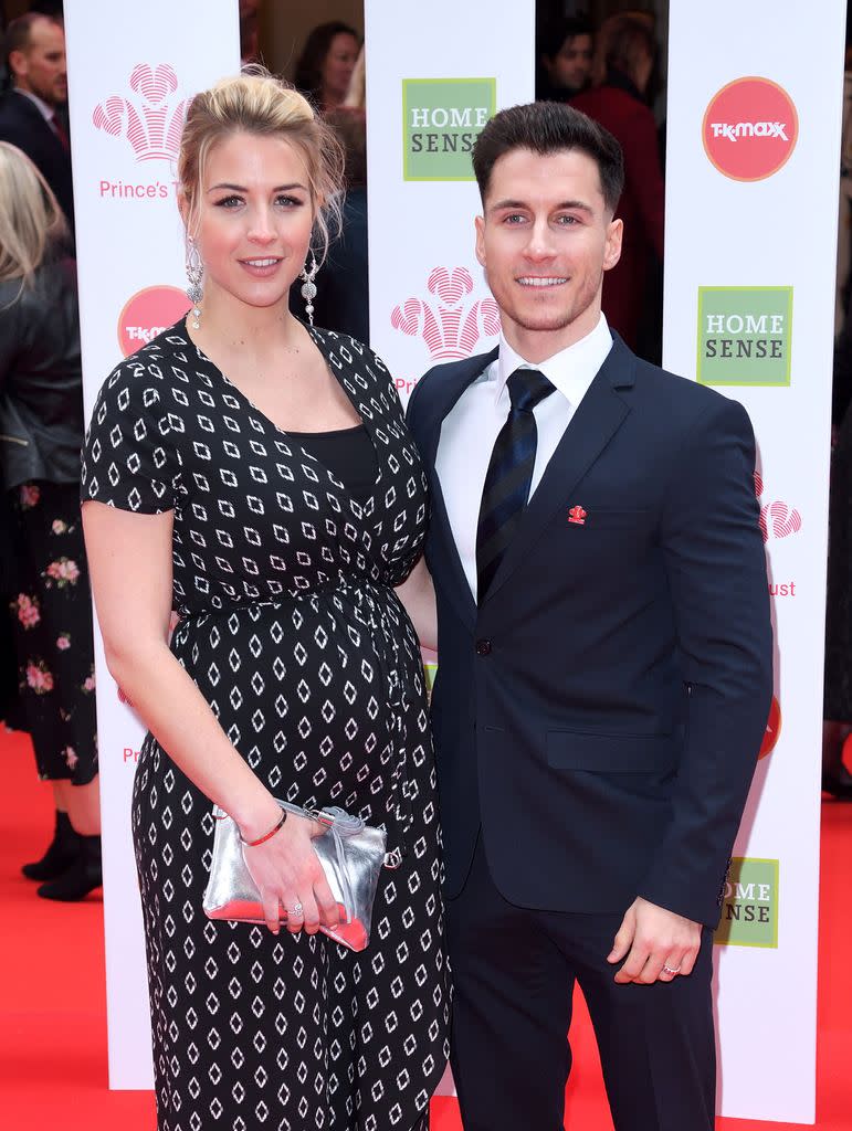 Pregnant Gemma Atkinson standing with Gorka Marquez