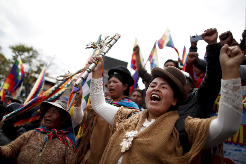 Backers of former President Evo Morales march in La Paz, Bolivia, Wednesday, Nov. 13, 2019. Bolivia's new interim president Jeanine Anez faces the challenge of stabilizing the nation and organizing national elections within three months at a time of political disputes that pushed Morales to fly off to self-exile in Mexico after 14 years in power. (AP Photo/Natacha Pisarenko)