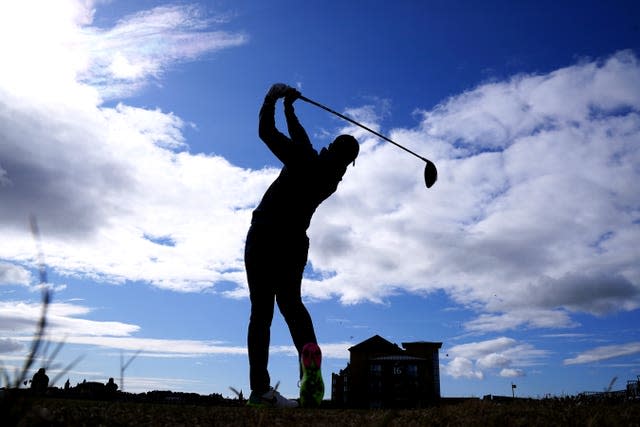 McIlroy drives over the hotel at the 17th hole