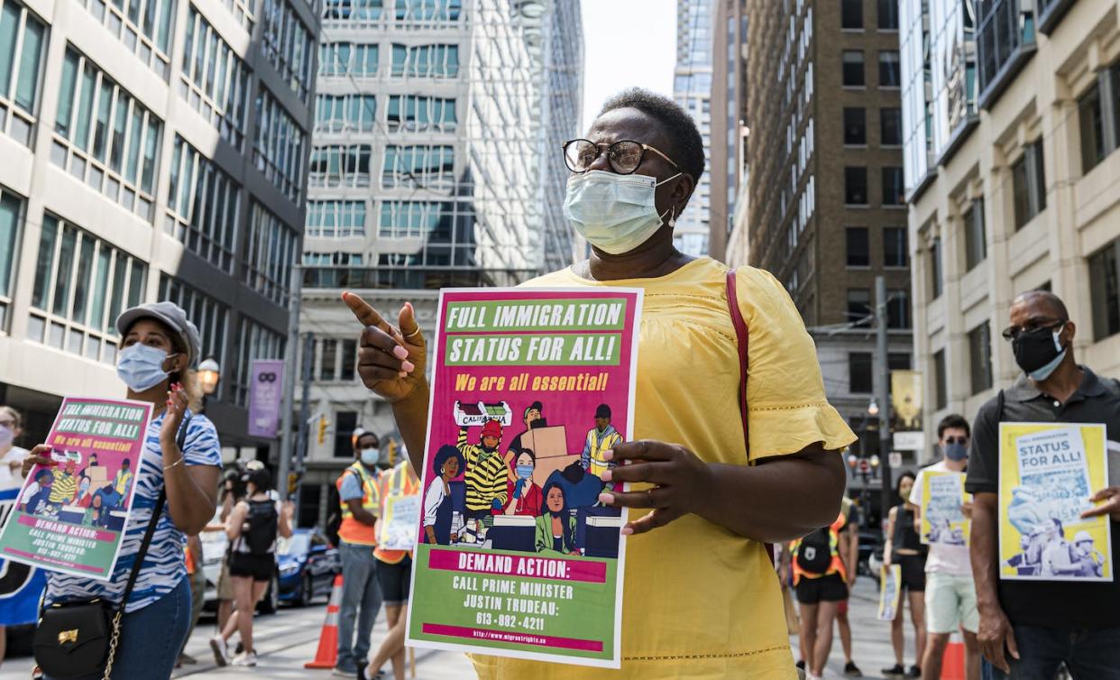 International human rights mechanisms alone cannot offer reliable solutions to racism, including racism affecting racialized migrants. Protestors support migrant worker rights in front of the Immigration and Refugee Board of Canada, in Toronto, in August 2020. THE CANADIAN PRESS/Christopher Katsarov