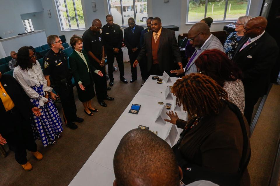 Members of the clergy bless the badges of first responders during the Blessing of the Badges service at DaySpring Baptist Church in 2019 in Gainesville. This year's service will be held at 3 p.m. Sunday at Abiding Faith Christian Church, 6529 NW 39th Ave. [Chris Day/Correspondent]
(Credit: File photo by Chris Day, Correspondent)