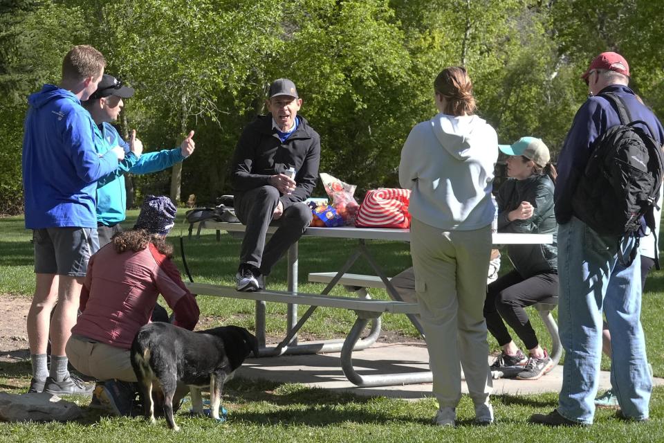 U.S. Rep. John Curtis talks with constituents while hiking along the Provo Canyon Trail on May 11, 2024, in Orem, Utah. Curtis is looking to carve out his own brand of conservatism in the post-Romney era of Utah politics, with a focus on bringing Republicans to the table on issues involving climate change. (AP Photo/Rick Bowmer)