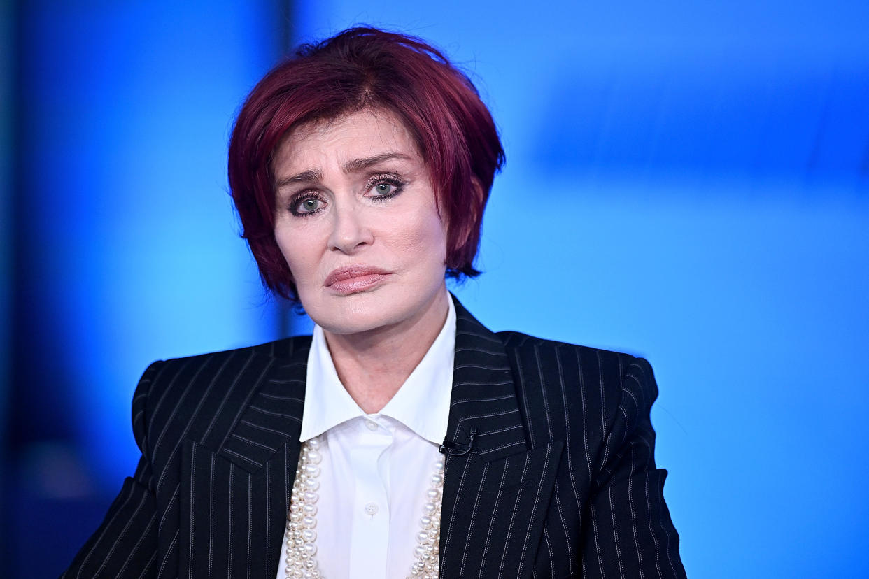 Sharon Osbourne wears a pinstripe suit