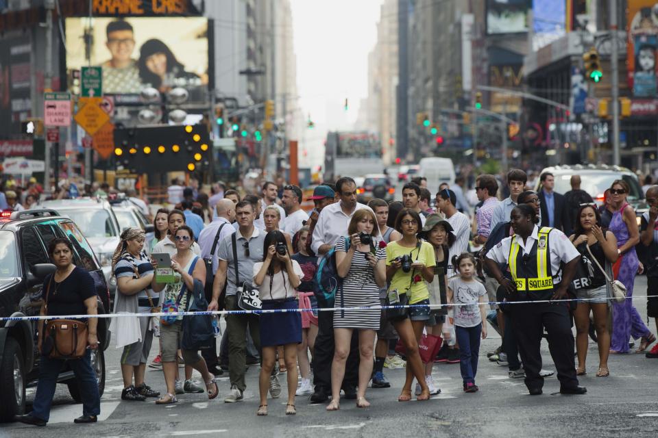 Double-decker tour buses collide in Times Square