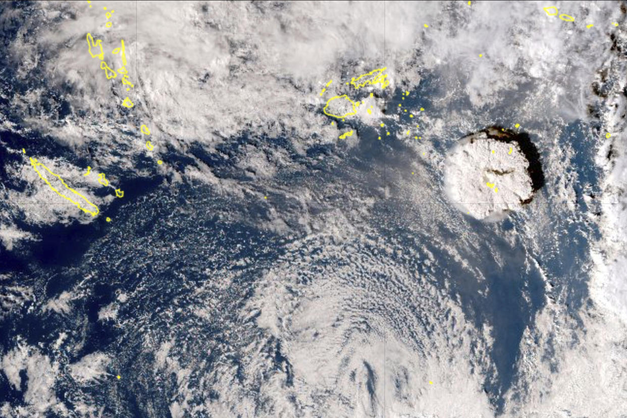 This satellite image taken by Himawari-8, a Japanese weather satellite, and released by the agency, shows an undersea volcano eruption at the Pacific nation of Tonga Saturday, Jan. 15, 2022. An undersea volcano erupted in spectacular fashion near the Pacific nation of Tonga on Saturday, sending large waves crashing across the shore and people rushing to higher ground. (Japan Meteorology Agency via AP)