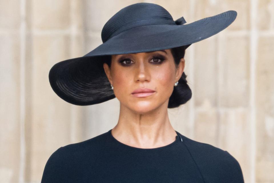 LONDON, ENGLAND - SEPTEMBER 19: (L-R) Meghan, Duchess of Sussex, during the State Funeral of Queen Elizabeth II at Westminster Abbey on September 19, 2022 in London, England. Elizabeth Alexandra Mary Windsor was born in Bruton Street, Mayfair, London on 21 April 1926. She married Prince Philip in 1947 and ascended the throne of the United Kingdom and Commonwealth on 6 February 1952 after the death of her Father, King George VI. Queen Elizabeth II died at Balmoral Castle in Scotland on September 8, 2022, and is succeeded by her eldest son, King Charles III. (Photo by Samir Hussein/WireImage)