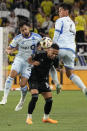 CF Montréal midfielder Mathieu Choinière (29) and defender Fernando Álvarez (4) battle Nashville SC midfielder Hany Mukhtar (10) for the ball during the first half of an MLS soccer match Saturday, May 4, 2024, in Nashville, Tenn. (AP Photo/George Walker IV)