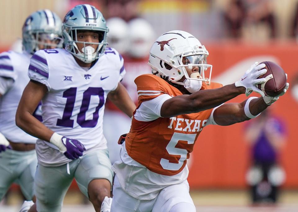 Texas receiver Adonai Mitchell hauls in a catch against Kansas State during the Longhorns' 33-30 overtime win Saturday at Royal-Memorial Stadium. Texas, which tops the Big 12 power poll, visits TCU this weekend.