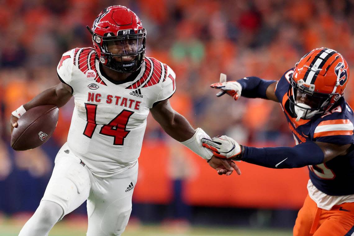 North Carolina State’s Jack Chambers (14) battles for yardage against Syracuse’s Isaiah Johnson (20) during the fourth quarter at JMA Wireless Dome on Saturday, Oct. 15, 2022, in Syracuse, New York. Bryan M. Bennett/TNS