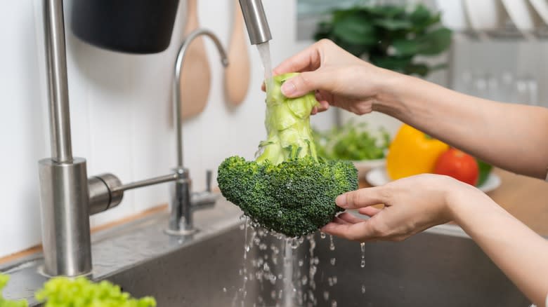 Broccoli being washed