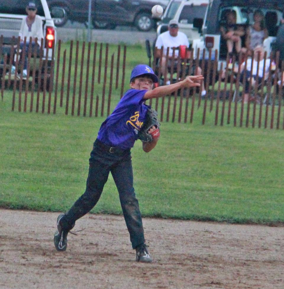 Bronson shortstop Mikeal Sias guns out a runner at first during the opener for the Vikings at the Branch County 4-H Fair Tournament.