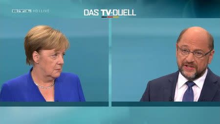 A screen shows the TV debate between German Chancellor Angela Merkel of the Christian Democratic Union (CDU) and her challenger Germany's Social Democratic Party SPD candidate for chancellor Martin Schulz in Berlin, Germany, September 3, 2017. German voters will take to the polls in a general election on September 24. Mediengruppe RTL Deutschland (MG RTL D)/Handout via REUTERS