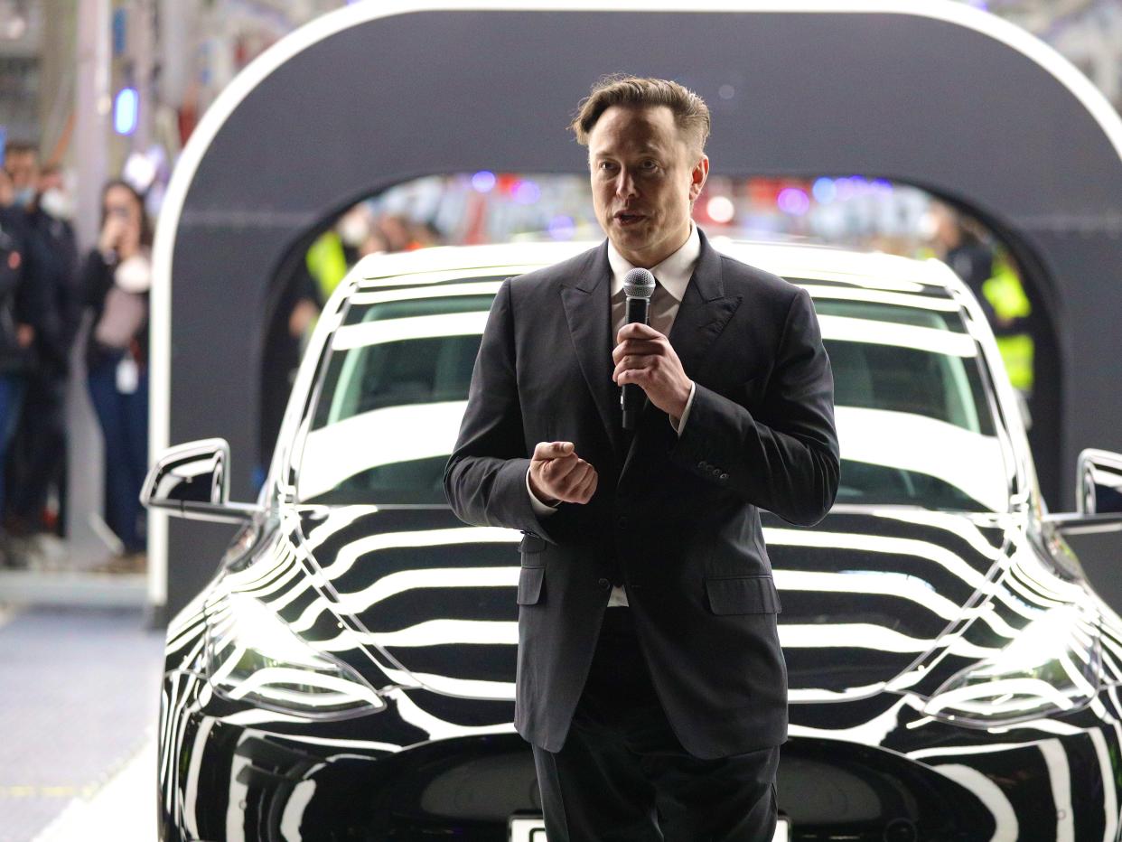 Elon Musk speaks at the opening of a new Tesla factory.