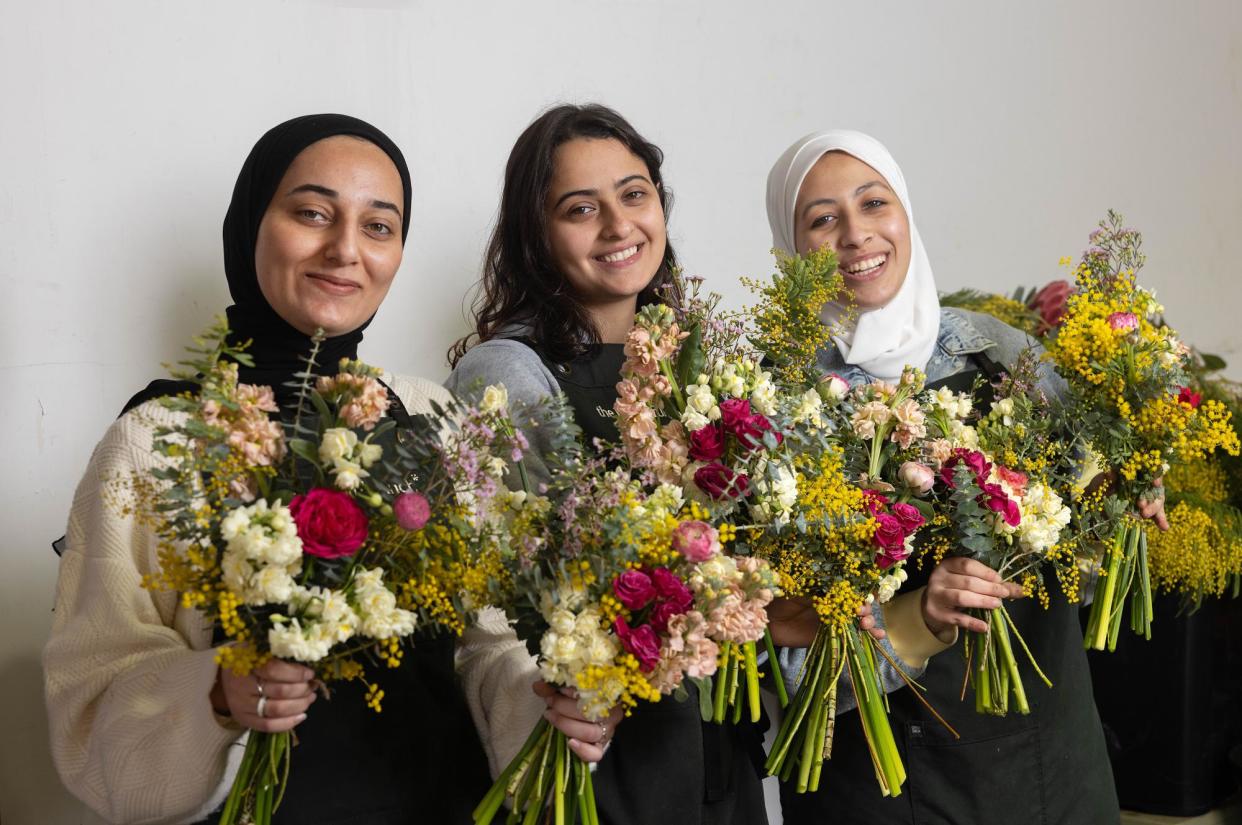 <span>From left: Shatha, Sara and Rahaf, three refugees from Palestine working at the Beautiful Bunch florist in Melbourne’s East Brunswick.</span><span>Photograph: Ellen Smith/The Guardian</span>