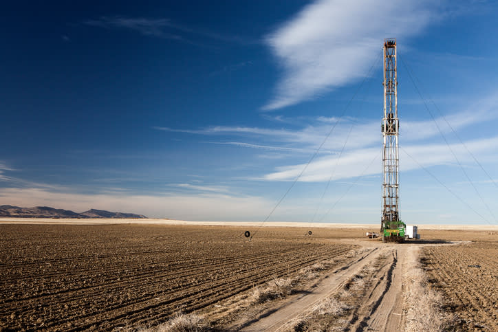 A shale oil rig in a field.