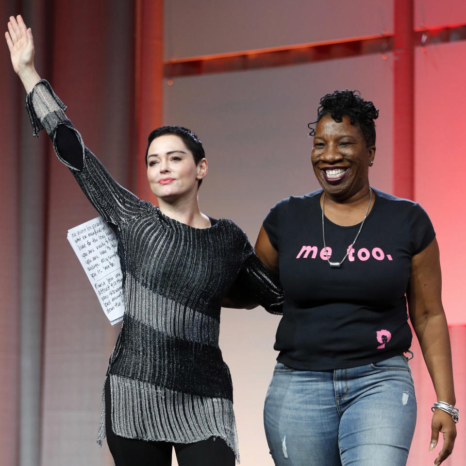 FILE - In this Oct. 27, 2017 file photo, actress Rose McGowan, left, waves after being introduced by Tarana Burke, right, founder of the #MeToo movement, at the inaugural Women's Convention in Detroit. According to a 2021 The Associated Press-NORC Center for Public Affairs Research poll, close to half of Americans say the recent attention to sexual misconduct has had a positive impact on the country overall - roughly twice the number that say it’s been negative, 45% vs. 24%. (AP Photo/Paul Sancya, File)