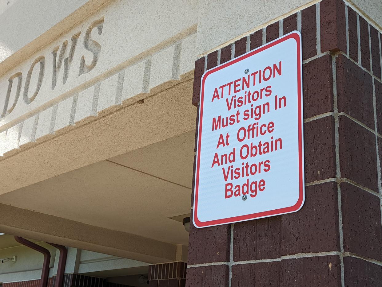 A sign outside Meadows Elementary School in Topeka advises visitors that they must enter through a secure entry and obtain a visitor's pass. While newer schools in Kansas have secured and monitored entryways, the average Kansas school was built in the 1950s, and some are in need of security retrofitting.