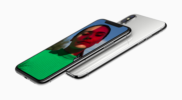 Two iPhone Xs are shown with one facing down and one facing up