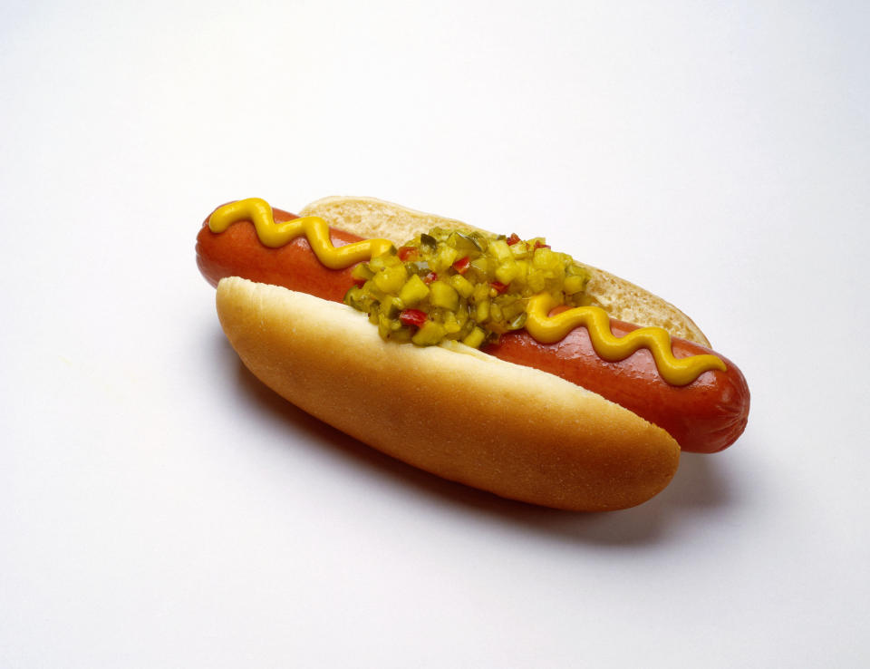 Hot dog with mustard and relish on a bun