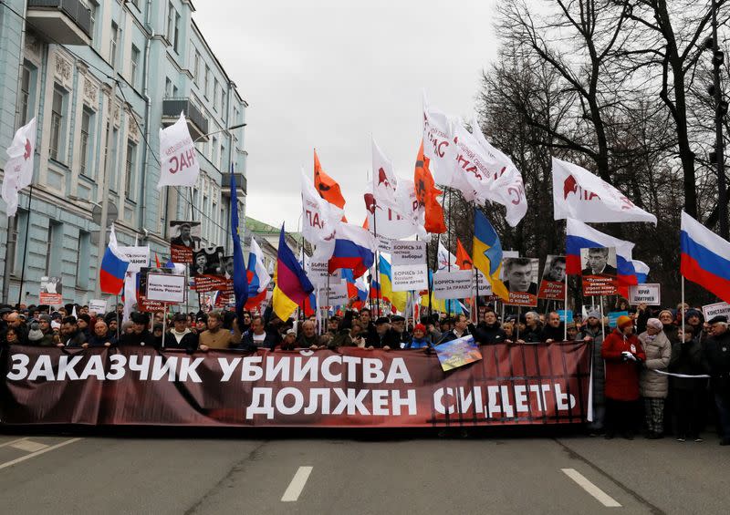 People take part in a rally to mark the 5th anniversary of Russian opposition politician Boris Nemtsov's murder and to protest against proposed amendments to the country's constitution, in Moscow