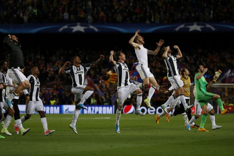 Juventus players celebrate winning after their UEFA Champions League quarter-final second leg match against Barcelona at the Camp Nou stadium in Barcelona on April 19, 2017