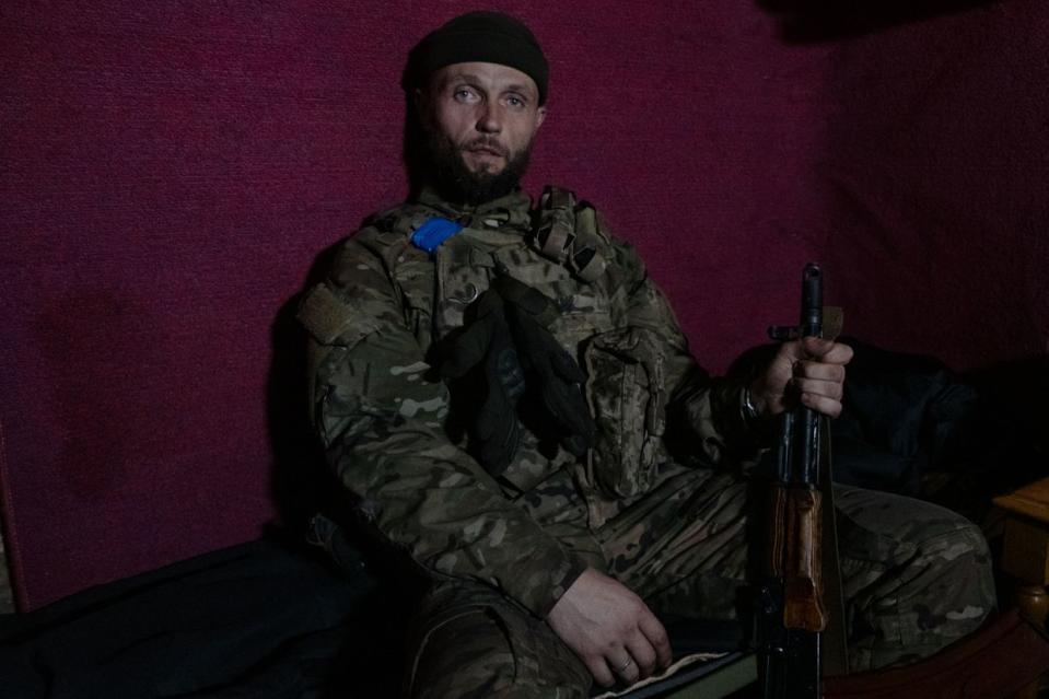 Ukrainian infantryman Andrii “Burzhui” in a basement near Chasiv Yar, Donetsk Oblast, on April 26, 2023. (Francis Farrell/The Kyiv Independent)