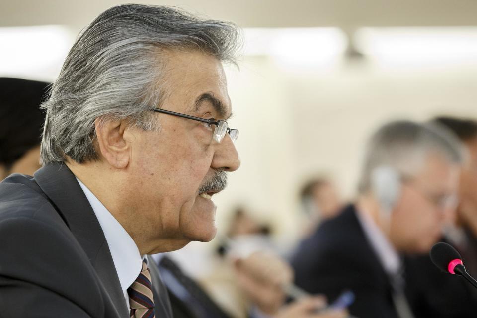 Faysal Khabbaz Hamoui, Ambassador of the Permanent Representative Mission of Syria to Geneva, delivers his speech during a session of the Human Rights Council on the report of the Commission of Inquiry on Human Rights in Syria at the European headquarters of the United Nations in Geneva, Switzerland, Tuesday, March 18, 2014. (AP Photo/Keystone, Salvatore Di Nolfi)