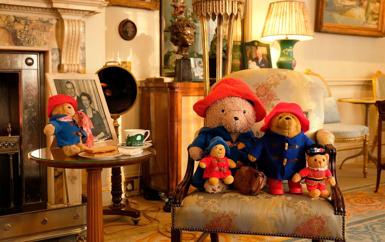 Paddington Bear toys with a cup of tea and a marmalade sandwich in the Morning Room at Clarence House - Buckingham Palace via AP
