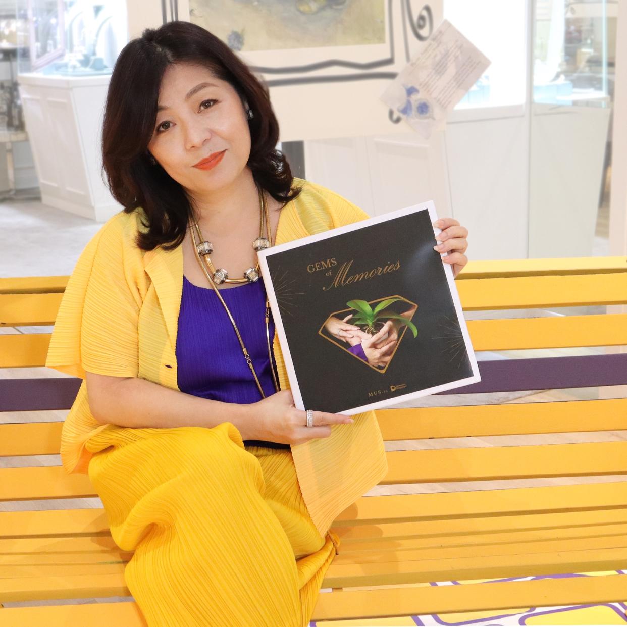 Esther Ho with the Gems of Memories book. (PHOTO: Esther Ho)