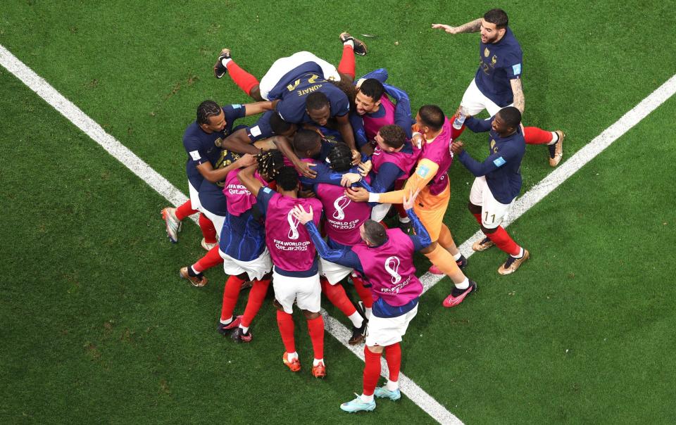 Randal Kolo Muani of France celebrates with teammates after scoring the team's second goal during the FIFA World Cup Qatar 2022 semi final match between France and Morocco - Richard Heathcote/Getty Images