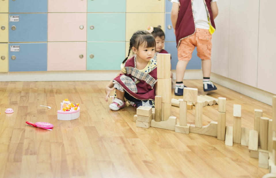 Kid playing toy building blocks