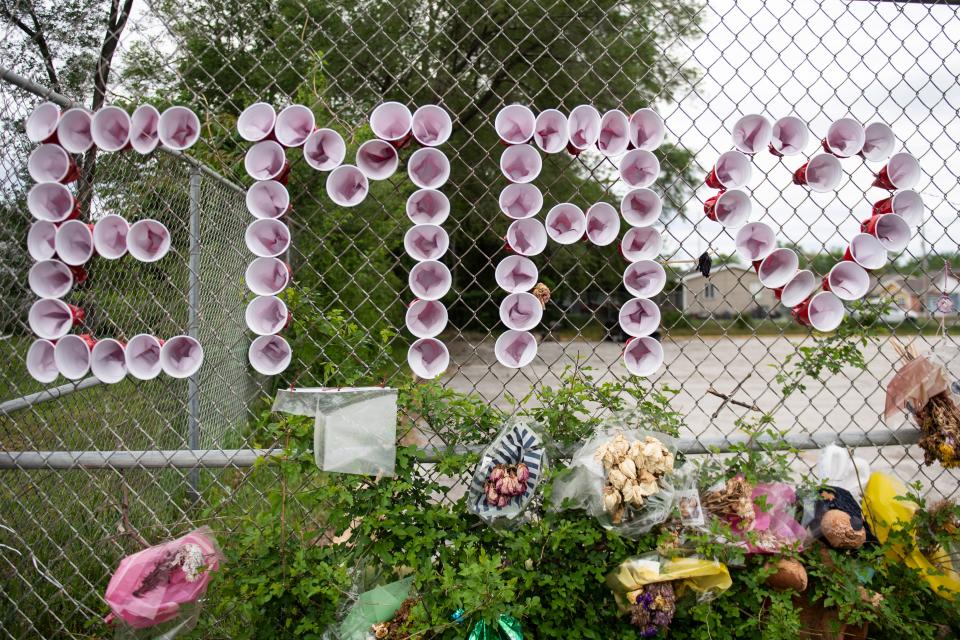 A makeshift memorial for 14-year-old Emma Cardenas near the section of East University Avenue in Des Moines where she was killed in a hit-and-run accident April 28.