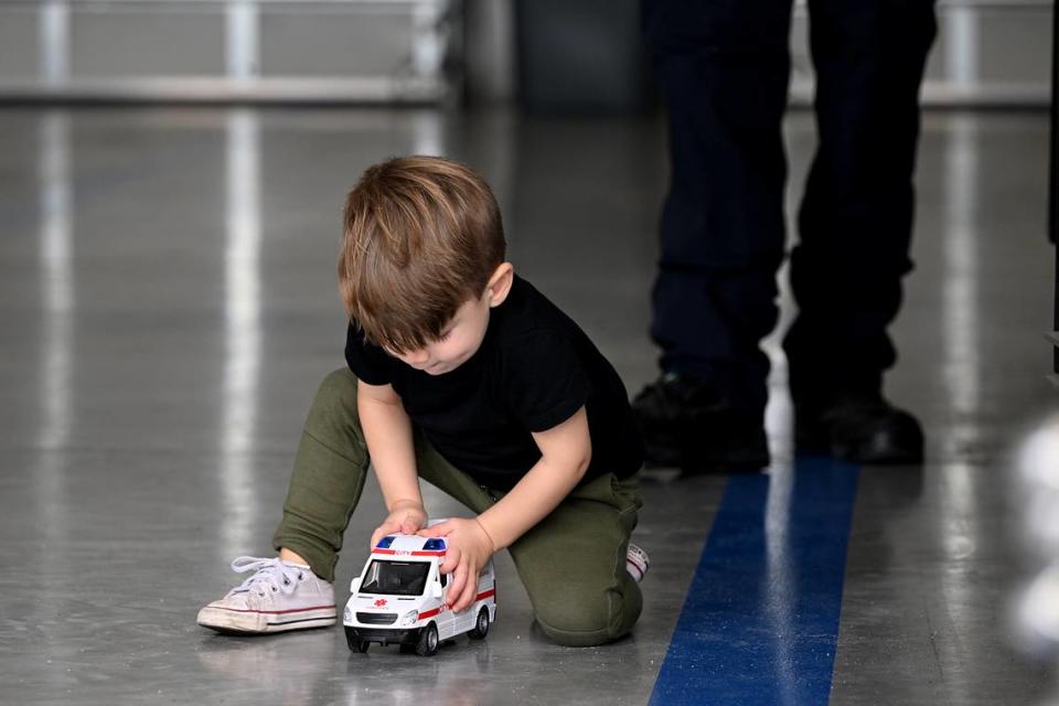 Nolan Backus, 2 1/2, plays with a toy ambulance he received as a gift when meeting the Manatee County charge paramedic Kevin Guido who treated him in an ambulance after he suffered a seizure at his daycare in March.