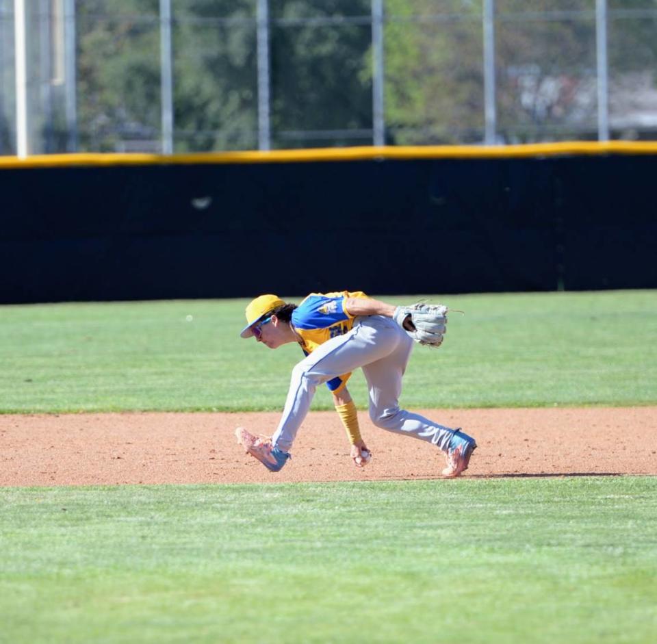Turlock shortstop Josh Ramirez barehands a ground ball during a CCAL matchup with Enochs at Enochs High School in Modesto, Calif. on Friday, April 19, 2024.