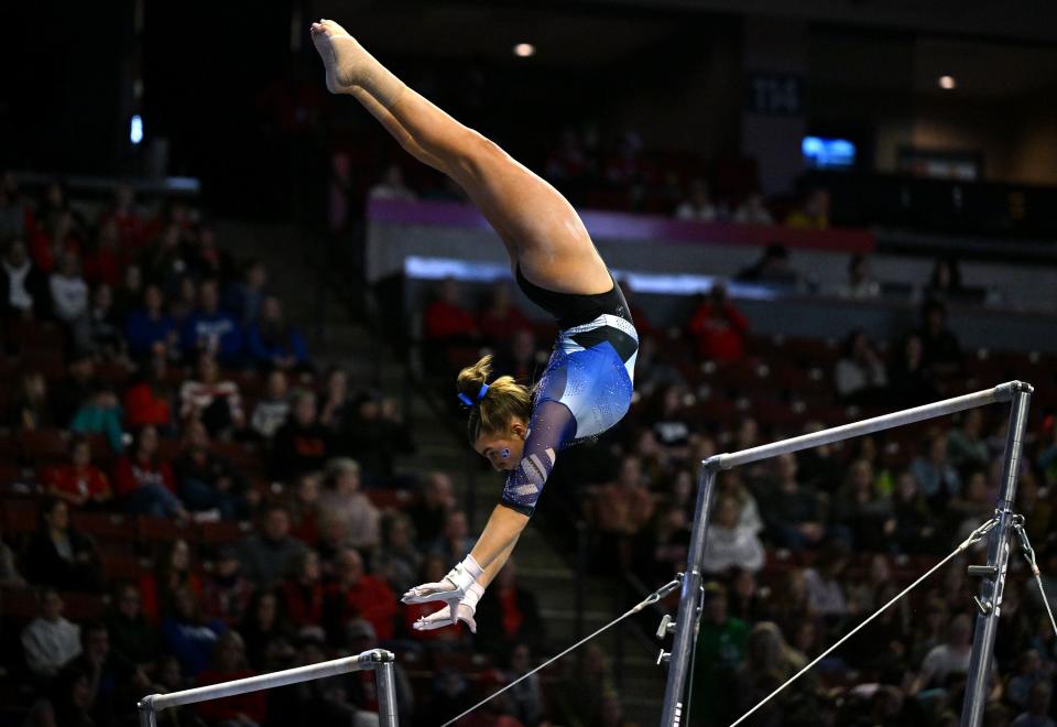 BYU’s Kylie Eaquinto reaches out for the lower bar during her routine as BYU, Utah, SUU and Utah State meet in the Rio Tinto Best of Utah Gymnastics competition at the Maverick Center in West Valley City on Monday, Jan. 15, 2024. | Scott G Winterton, Deseret News