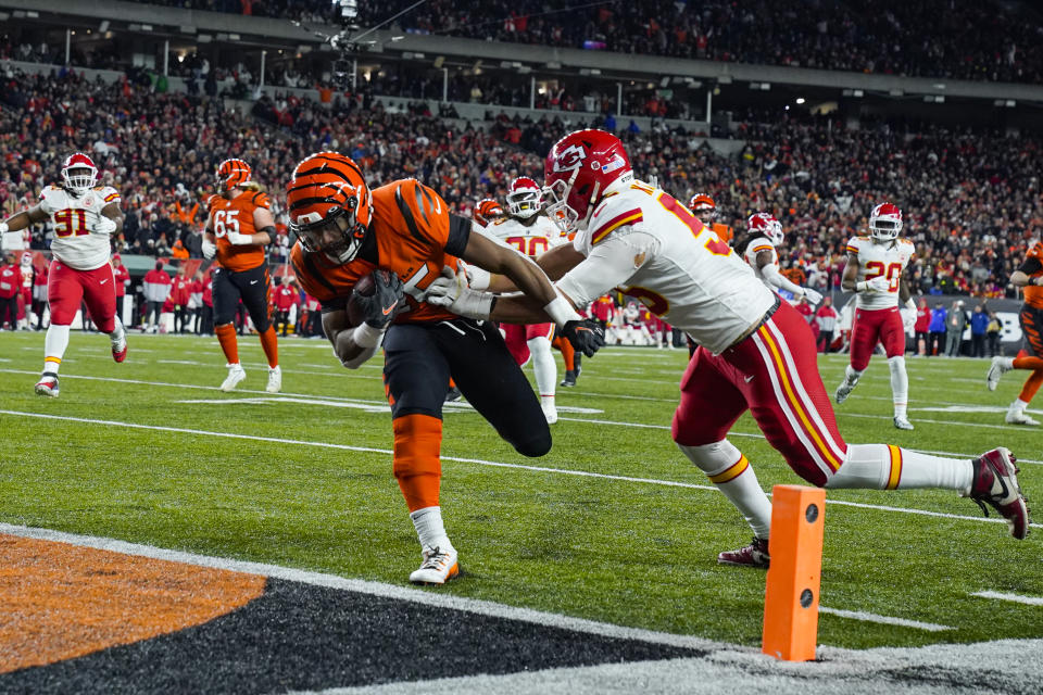 Cincinnati Bengals running back Chris Evans (25) runs in for a touchdown past Kansas City Chiefs defensive end George Karlaftis (56) in the second half of an NFL football game in Cincinnati, Fla., Sunday, Dec. 4, 2022. (AP Photo/Jeff Dean)