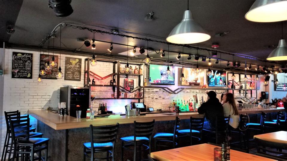 The bar at Fire Fresh Grill, upstairs on Main Street in downtown Sarasota, seen on a Saturday afternoon in late January 2022.