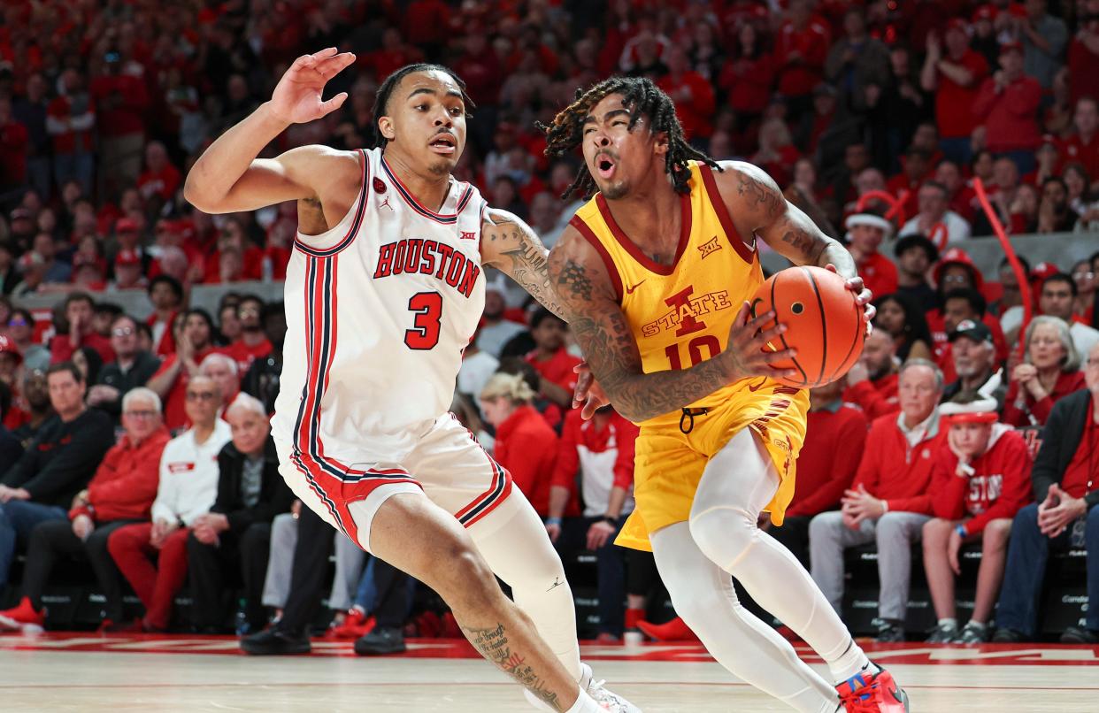 Iowa State's Keshon Gilbert drives against Houston's Ramon Walker Jr. on Monday in their Big 12 contest.