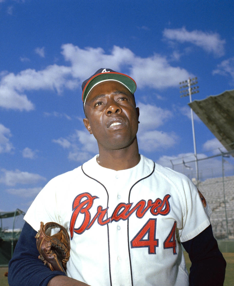 FILE - Atlanta Braves' Hank Aaron is seen, March 1967. Aaron made history with one swing of his bat. A year later and on the other side of Georgia, Lee Elder made history with one swing of his driver. Their deaths in 2021 were mourned beyond the sports world and were reminders of the hate, hardships and obstacles they endured with dignity on their way to breaking records and barriers. (AP Photo, File)