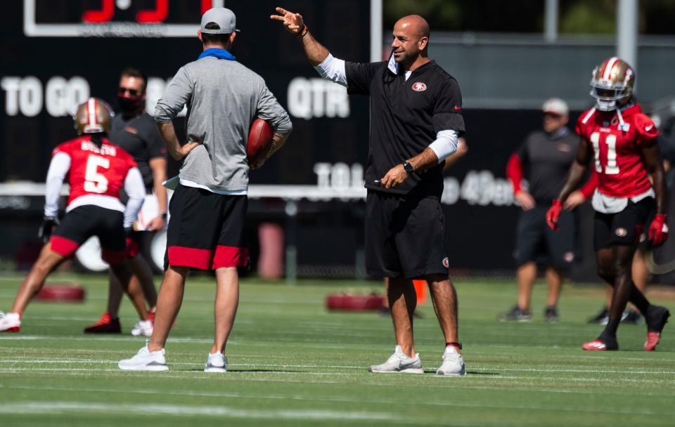 San Francisco 49ers defensive coordinator Robert Saleh, right, trains during NFL football training camp practice Saturday, Aug. 15, 2020, at the SAP Performance Facility in Santa Clara, Calif. (Xavier Mascarenas/The Sacramento Bee via AP, Pool)